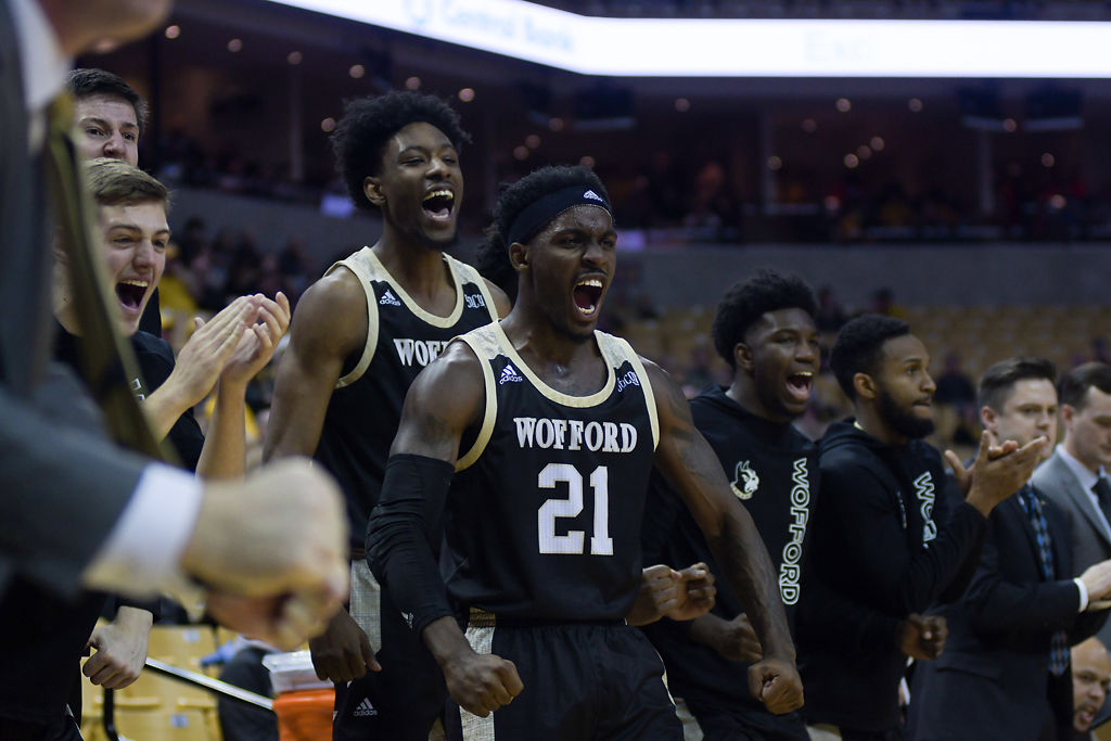 Wofford player Tray Hollowell cheers for his team after they scored a point against the Mizzou basketball team